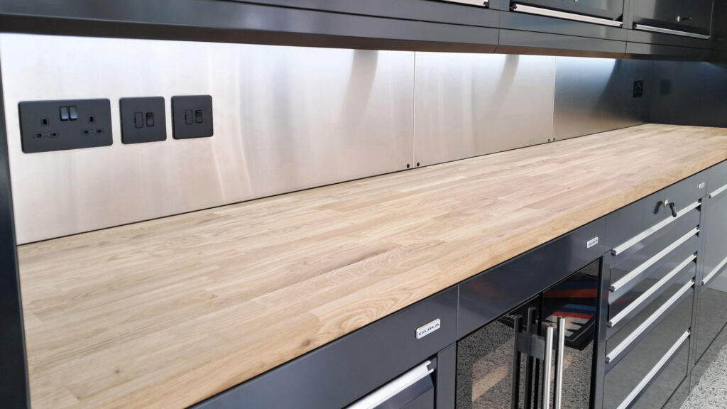 Solid oak worktop with black-grey cabinets